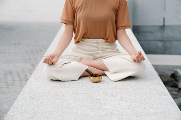 https://www.pexels.com/photo/a-woman-meditating-with-a-singing-bowl-9031632/