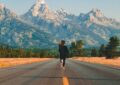 woman walking on road during daytime